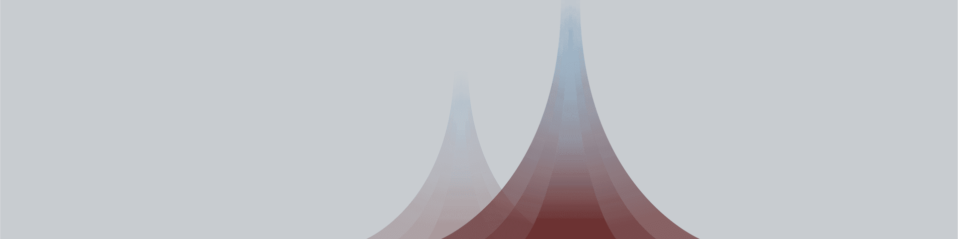 Two abstract gradient spires, one reddish-blue and one lighter, against a grey background.